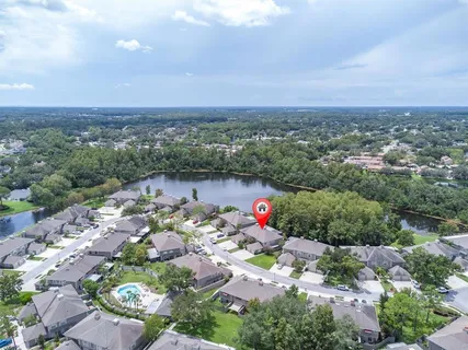 an aerial view of a houses with a yard