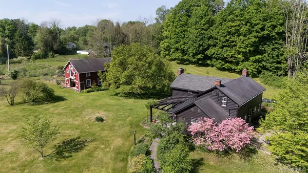 a view of a house with a garden