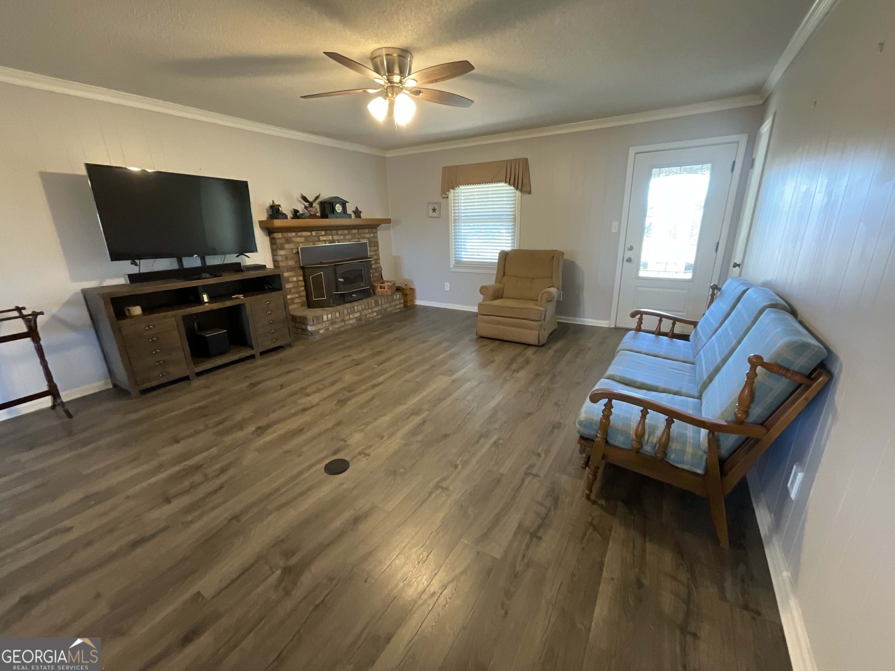 501 Raleigh Road Woodbury, GA 30293 - Photo 21 of 94 a living room with furniture and a flat screen tv