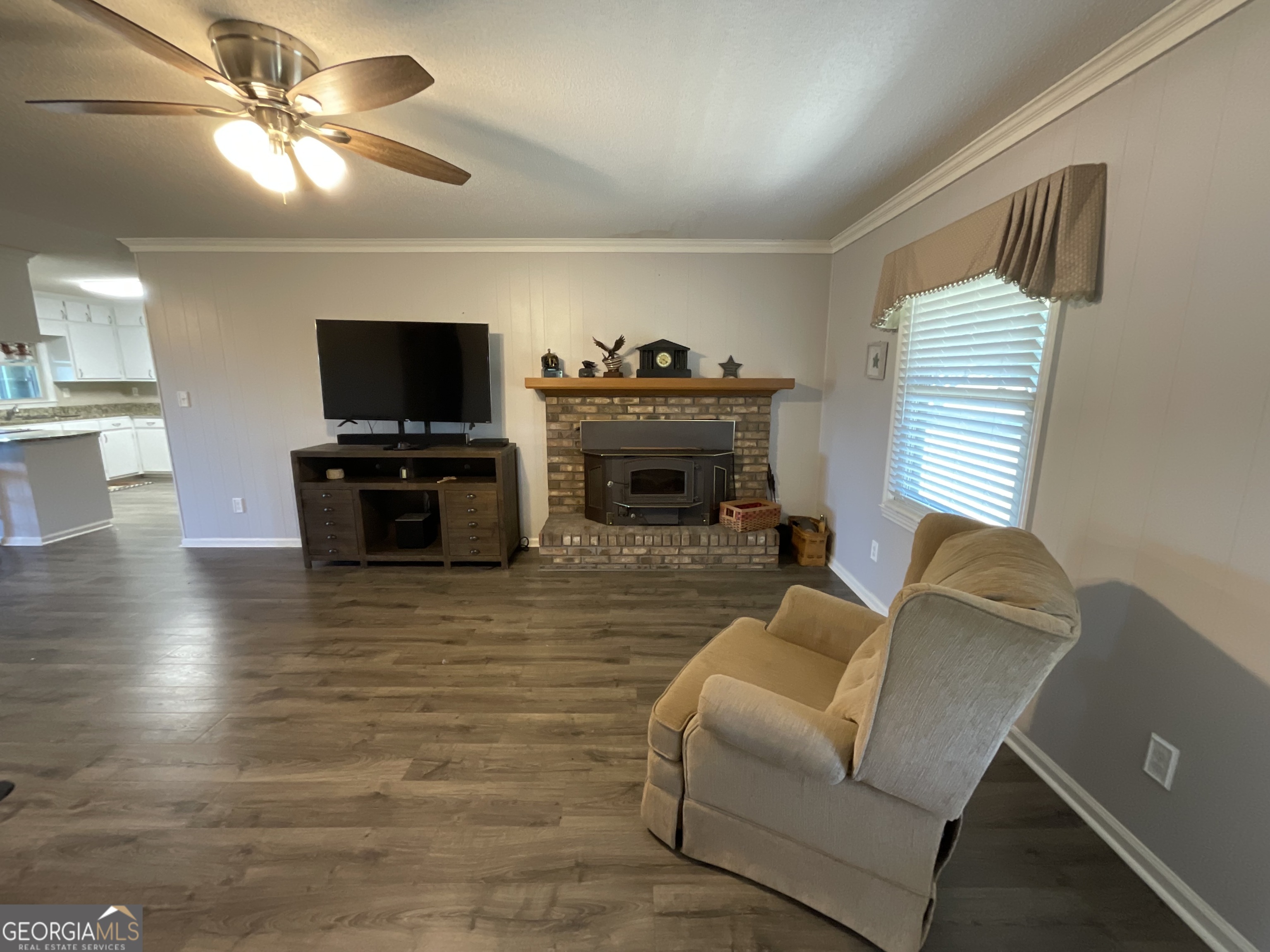 501 Raleigh Road Woodbury, GA 30293 - Photo 22 of 94 a living room with furniture and a flat screen tv