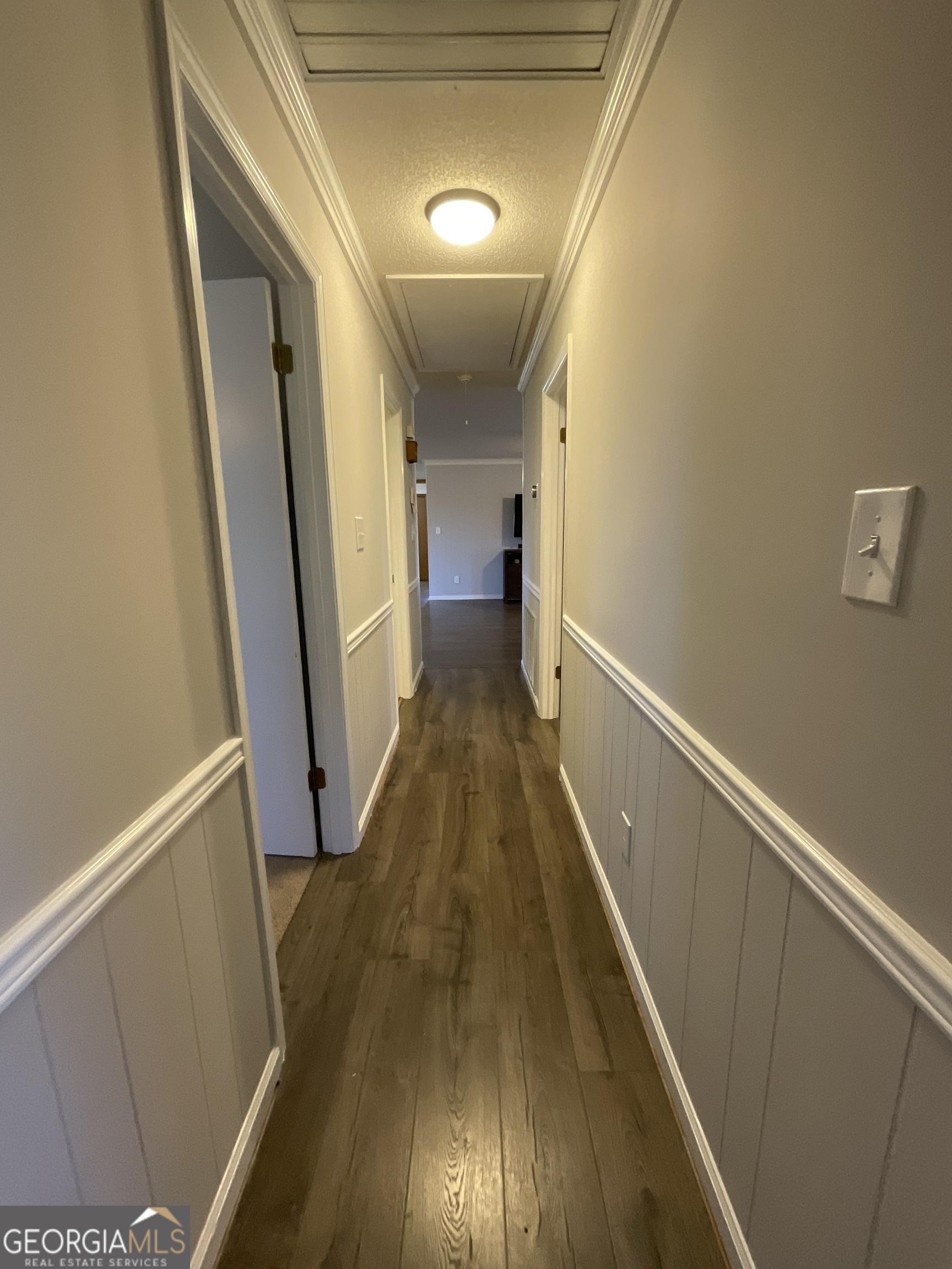 501 Raleigh Road Woodbury, GA 30293 - Photo 28 of 94 a view of a hallway with wooden floor and staircase