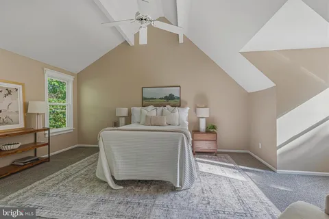 a bed room with a bed and a couch