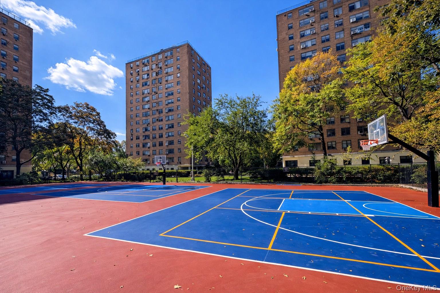 21-20 33rd Road, Unit 10B Queens, NY 11106 - Photo 15 of 17 a view of an outdoor space and tennis court