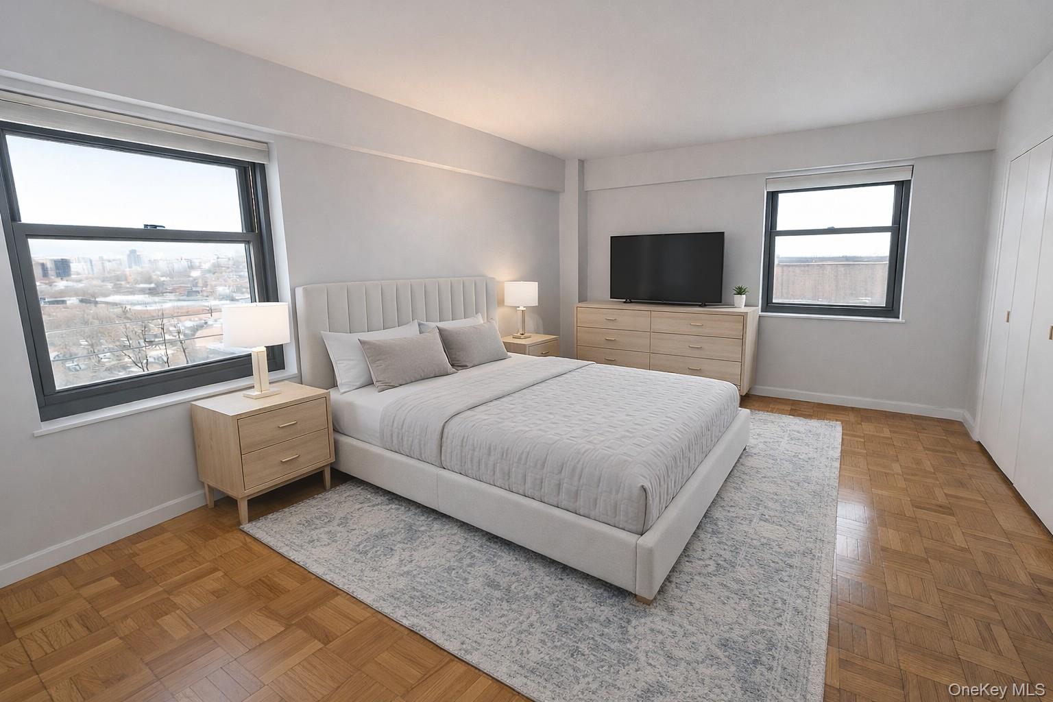 21-20 33rd Road, Unit 10B Queens, NY 11106 - Photo 6 of 17 a bedroom with a bed and a large window