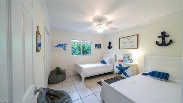 a bedroom with furniture and a window