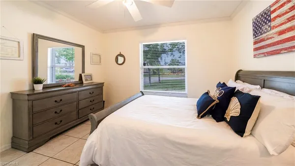 a bed room with a bed and a window