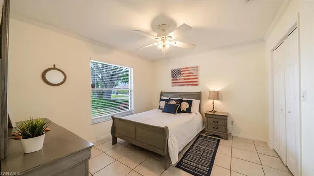 a bedroom with a bed and window