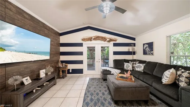 a living room with furniture fireplace and flat screen tv