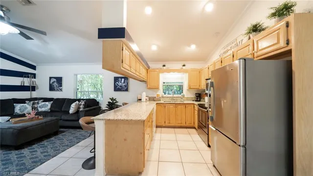 a very nice looking kitchen with a large window