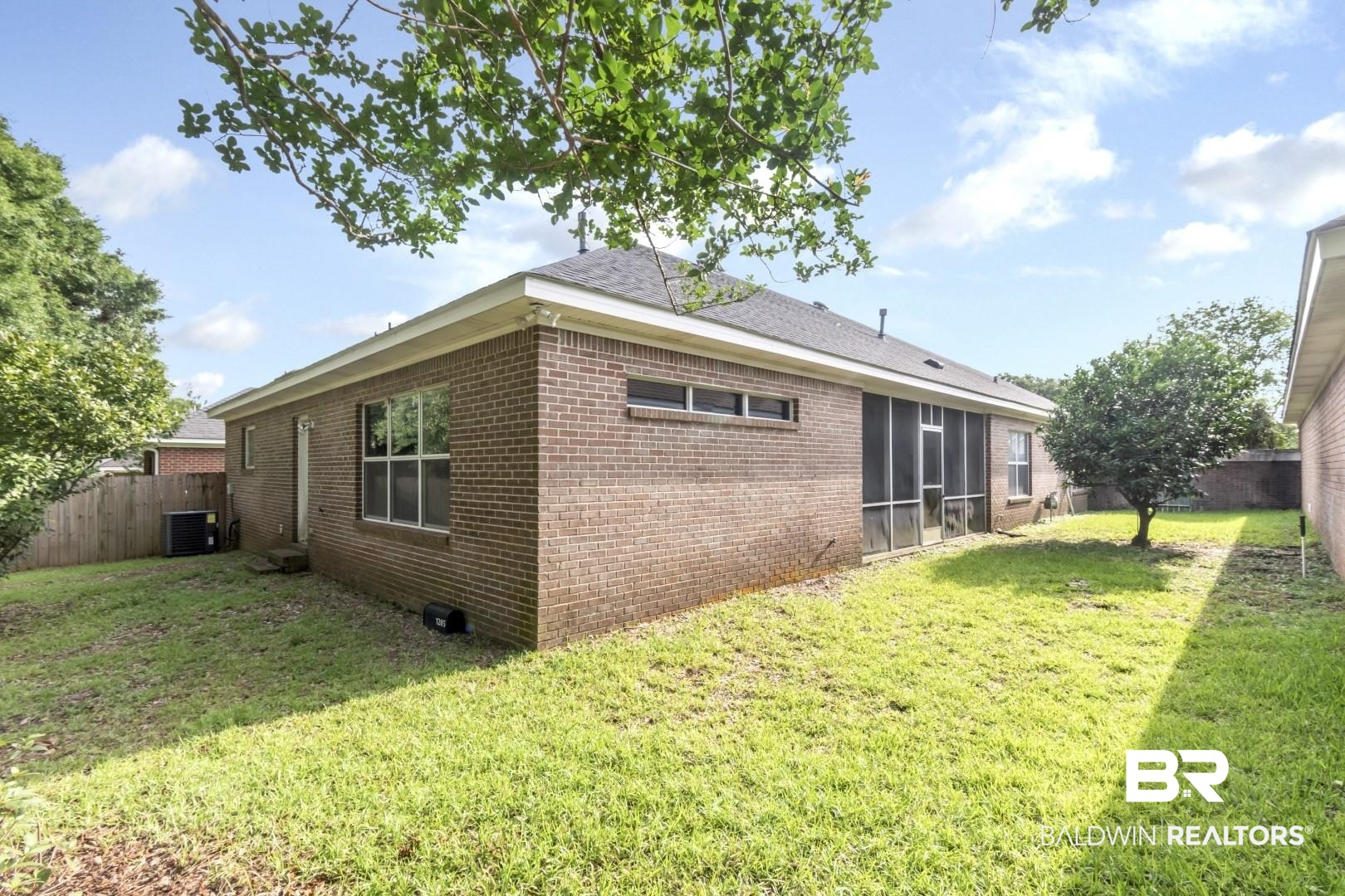 1205 Hillcrest Crossing East Mobile, AL 36695 - Photo 36 of 40 Rear view of property with a yard and central AC