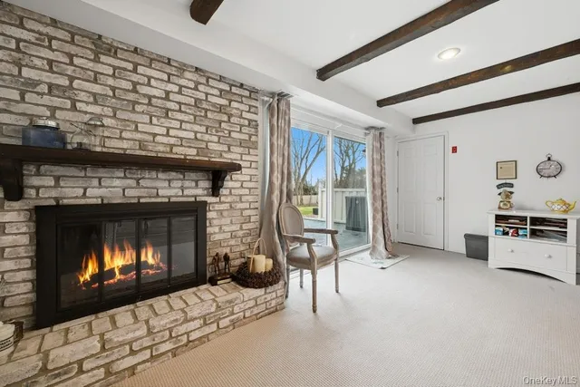 a bedroom with a bed chair and window