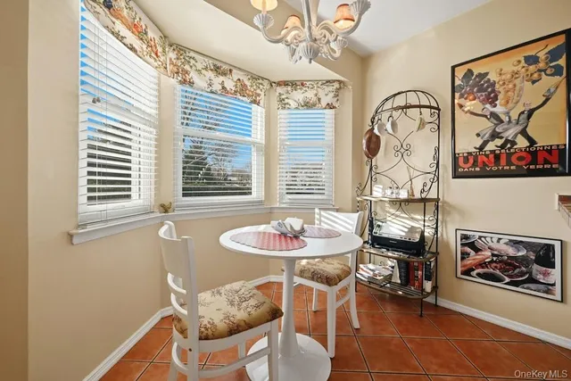 a kitchen with stainless steel appliances granite countertop a sink stove refrigerator and cabinets
