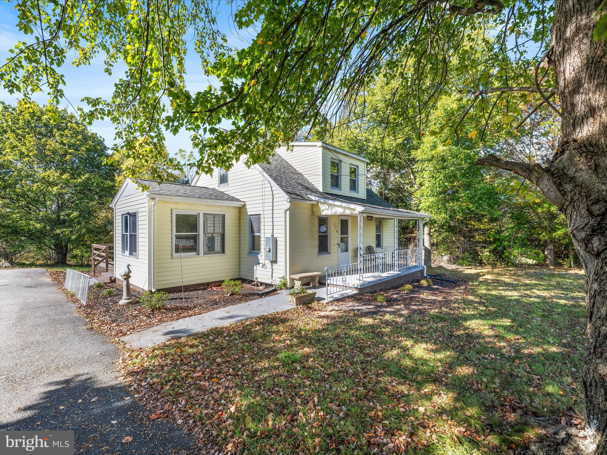 298 Bufflick Road Winchester, VA 22602 - Photo 1 of 38 a view of a house with a large tree and a yard