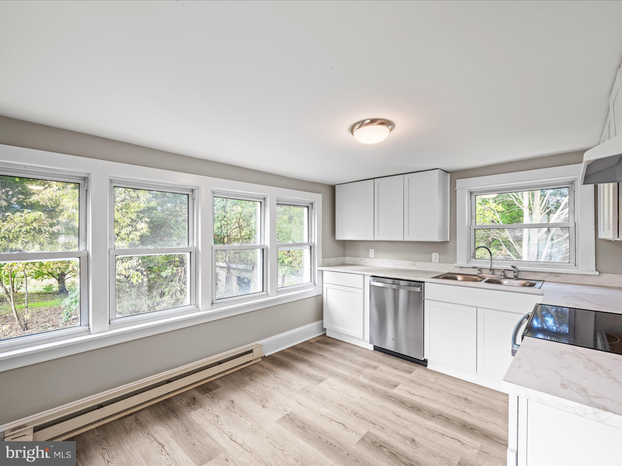 298 Bufflick Road Winchester, VA 22602 - Photo 11 of 38 a kitchen with a stove a sink and a granite counter tops