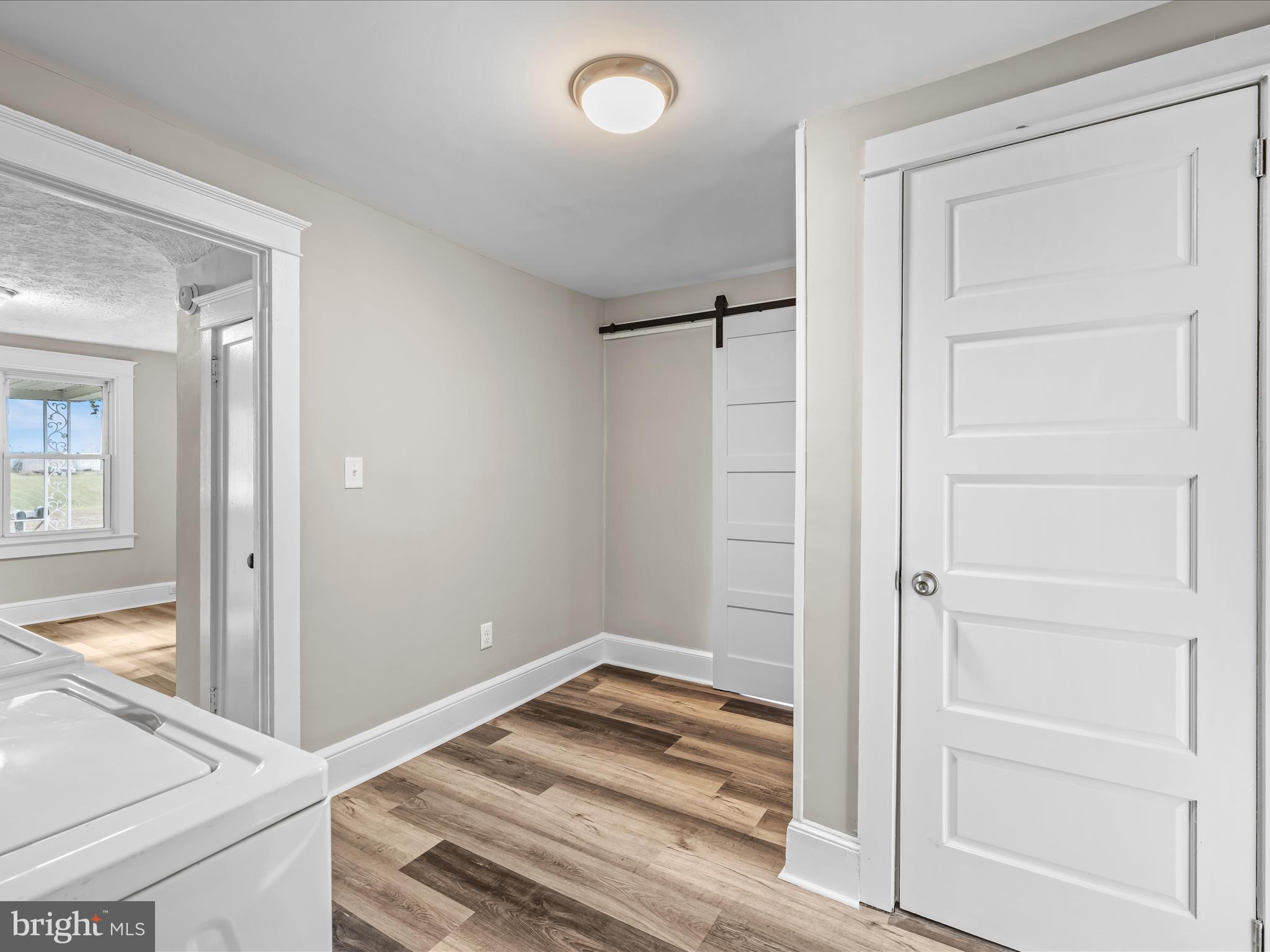 298 Bufflick Road Winchester, VA 22602 - Photo 14 of 38 a view of a hallway with wooden floor and entryway
