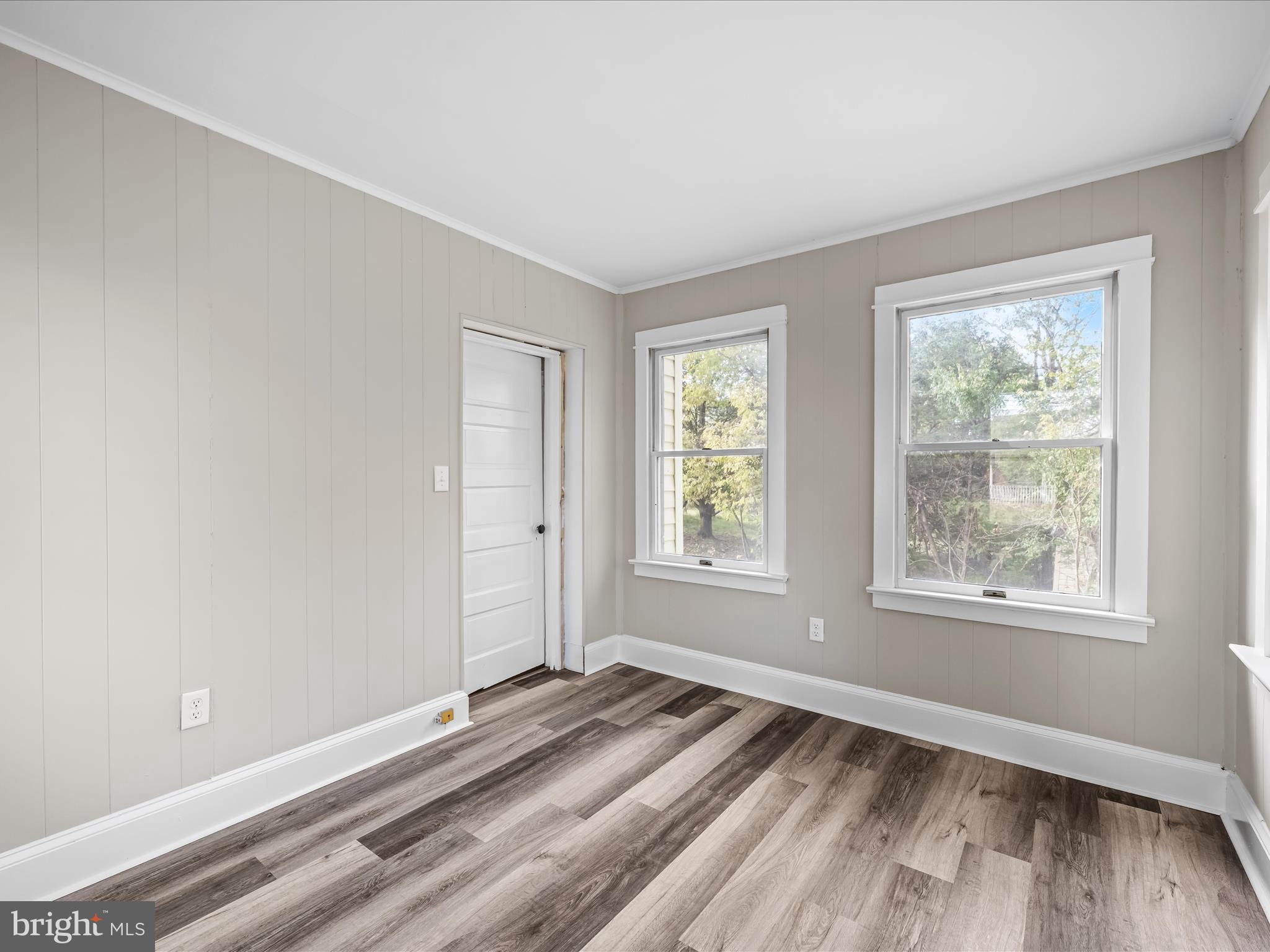 298 Bufflick Road Winchester, VA 22602 - Photo 17 of 38 a view of an empty room with wooden floor and a window