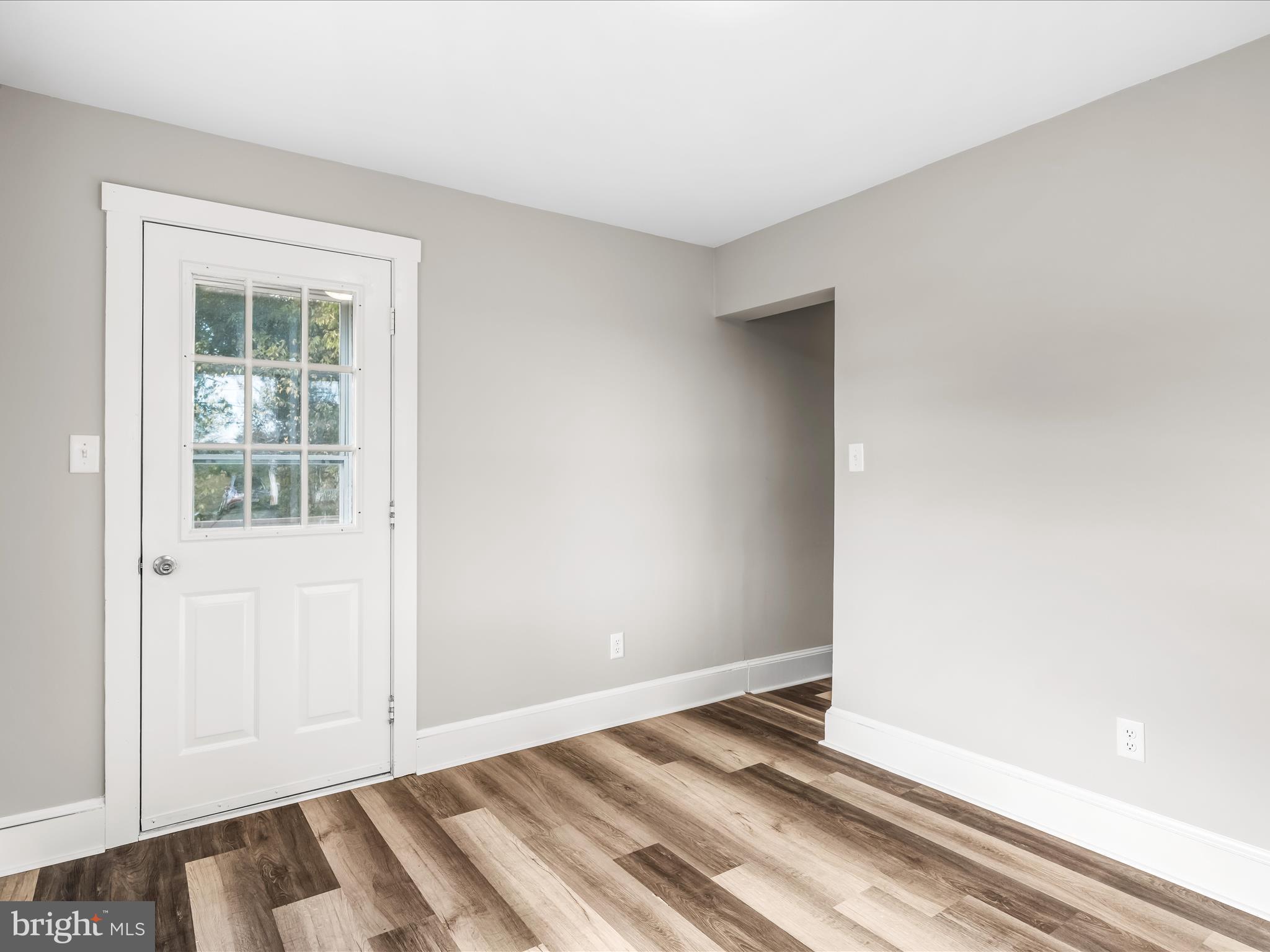 298 Bufflick Road Winchester, VA 22602 - Photo 18 of 38 an empty room with wooden floor and windows
