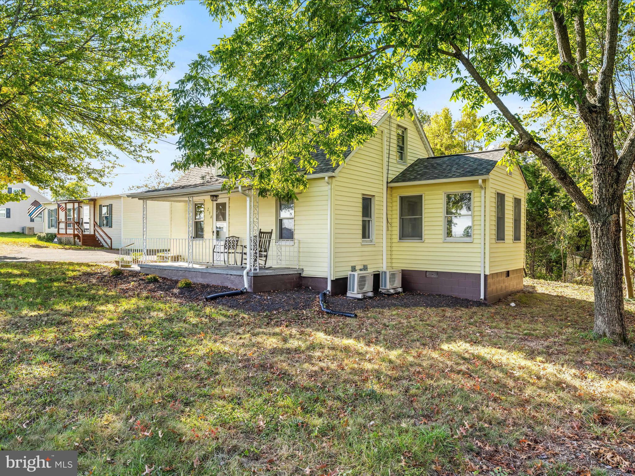 298 Bufflick Road Winchester, VA 22602 - Photo 2 of 38 a view of a house with a yard chairs and a table