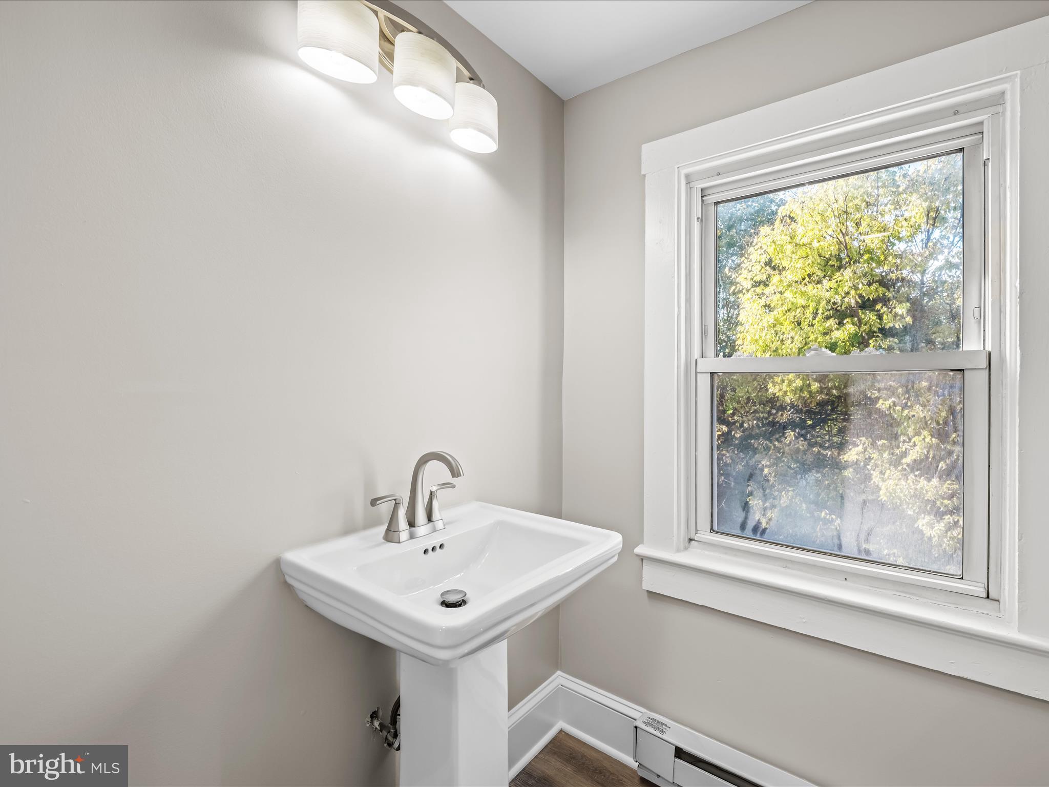 298 Bufflick Road Winchester, VA 22602 - Photo 21 of 38 a bathroom with a sink a mirror and a window