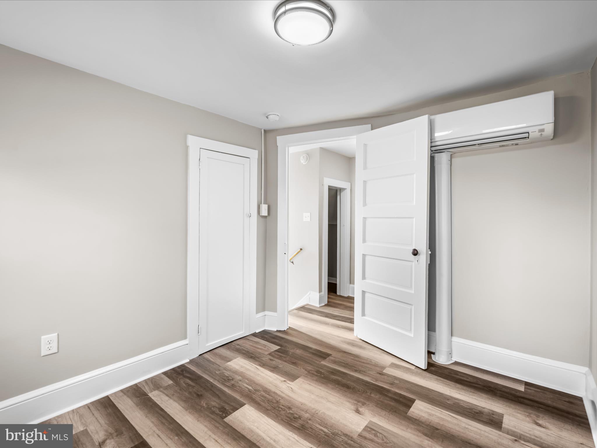 298 Bufflick Road Winchester, VA 22602 - Photo 22 of 38 a view of a bedroom with wooden floor and bathroom