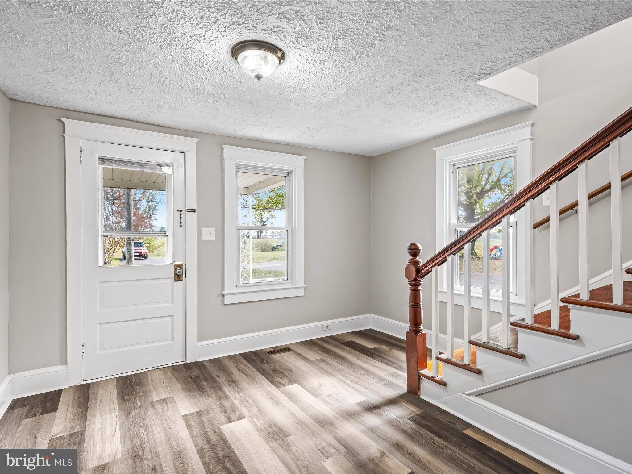 298 Bufflick Road Winchester, VA 22602 - Photo 3 of 38 a view of entryway with wooden floor and stairs
