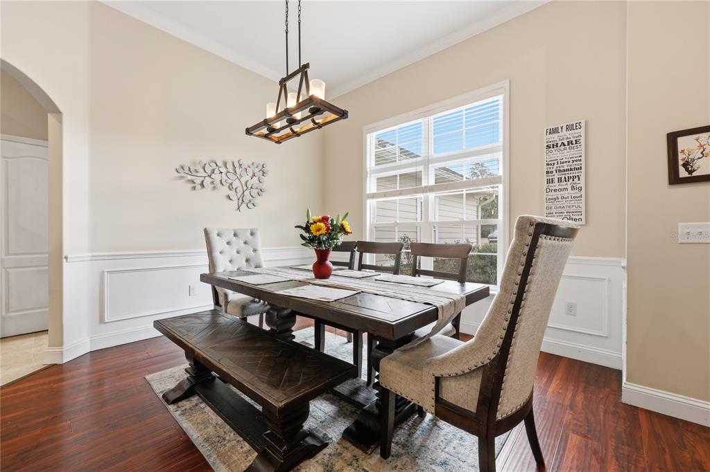 24934 Northwest 170th Road High Springs, FL 32643 - Photo 12 of 33 a view of a dining room with furniture window and wooden floor