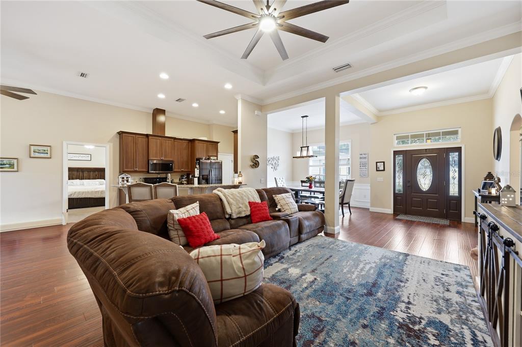 24934 Northwest 170th Road High Springs, FL 32643 - Photo 14 of 33 a living room with furniture kitchen view and a fireplace