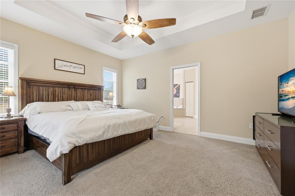 24934 Northwest 170th Road High Springs, FL 32643 - Photo 18 of 33 a bed room with a bed and a tv
