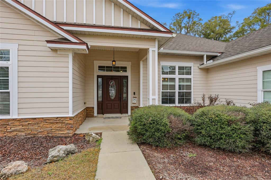24934 Northwest 170th Road High Springs, FL 32643 - Photo 2 of 33 a front view of a house with a yard and garage