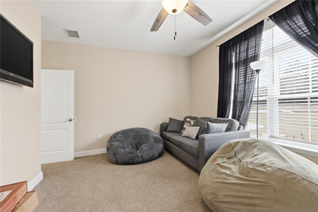 24934 Northwest 170th Road High Springs, FL 32643 - Photo 22 of 33 a living room with furniture a flat screen tv and a window