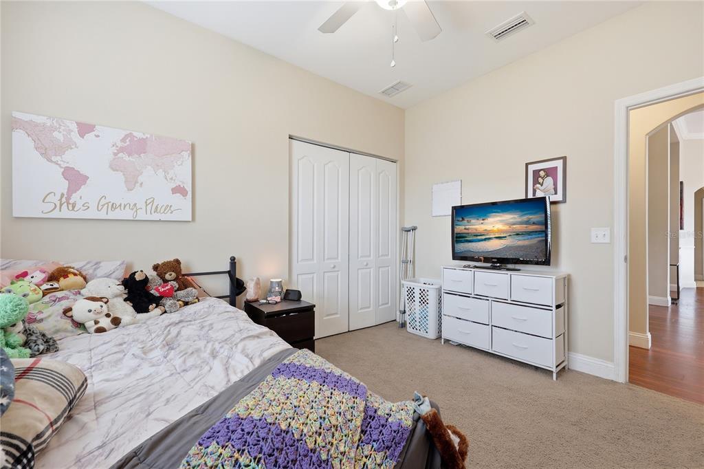 24934 Northwest 170th Road High Springs, FL 32643 - Photo 23 of 33 a bedroom with furniture and a flat screen tv