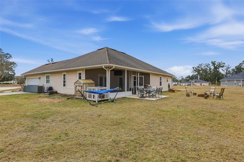 24934 Northwest 170th Road High Springs, FL 32643 - Photo 32 of 33 a view of a house with backyard porch and sitting area