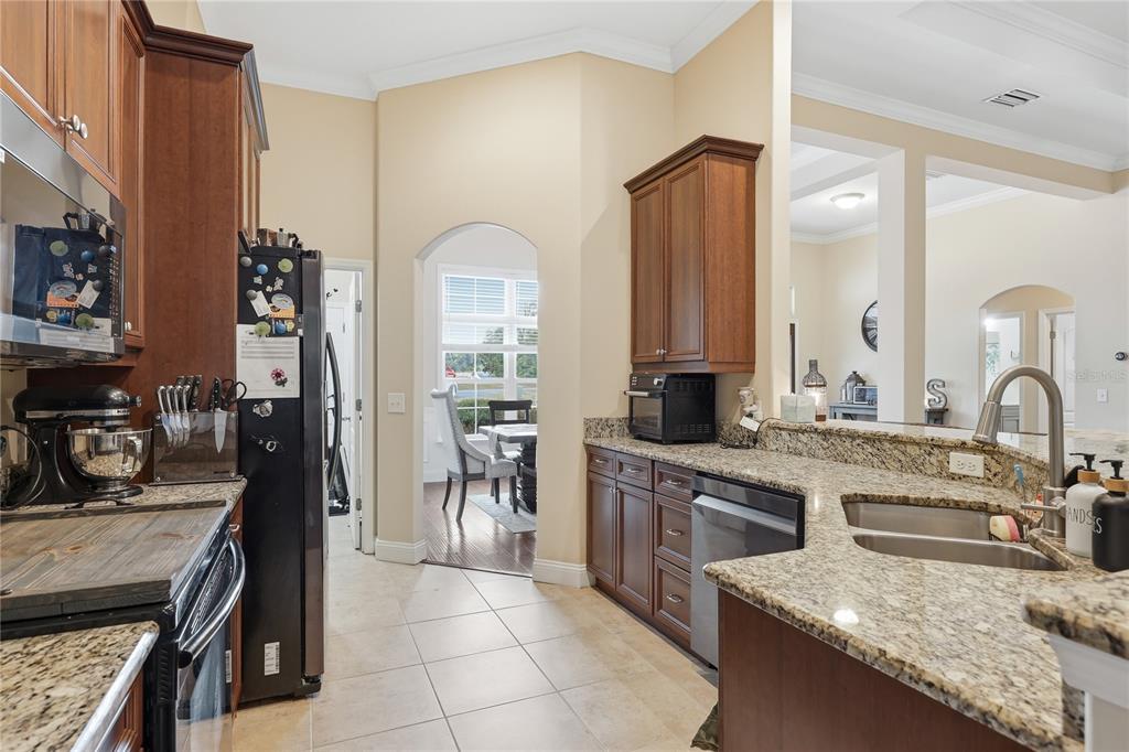 24934 Northwest 170th Road High Springs, FL 32643 - Photo 9 of 33 a kitchen with a sink stove and cabinets