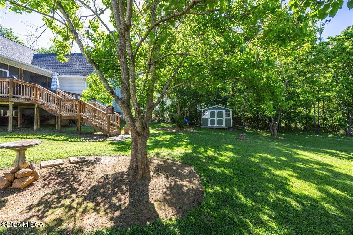 619 Grayridge Road Gray, GA 31032 - Photo 38 of 40 a view of a house with backyard and a tree