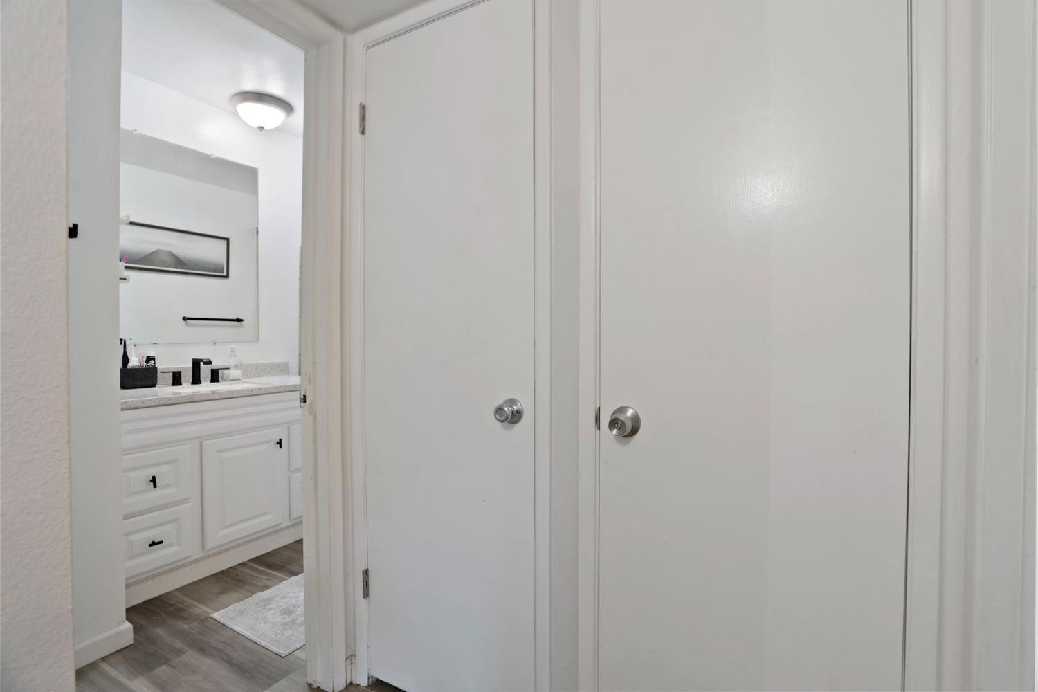 3623 Appleton Way Stockton, CA 95219 - Photo 14 of 34 hallway to bathroom with storage closet & water heater
