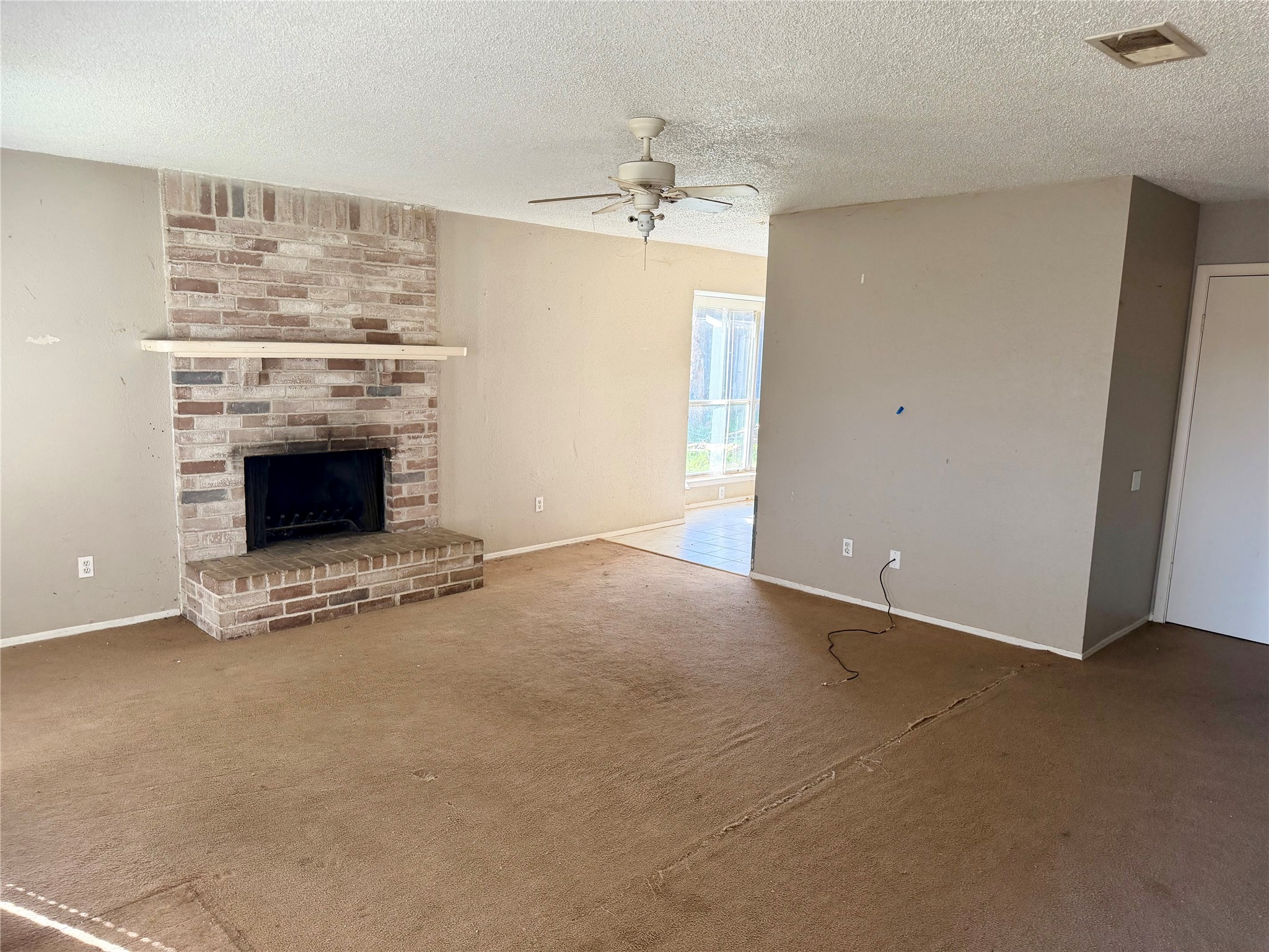 23815 Firegate Drive Spring, TX 77373 - Photo 3 of 21 an empty room with windows and fireplace