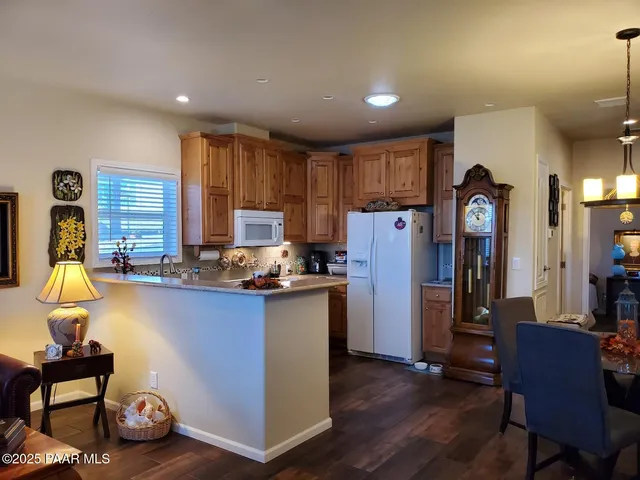 a kitchen with refrigerator and window