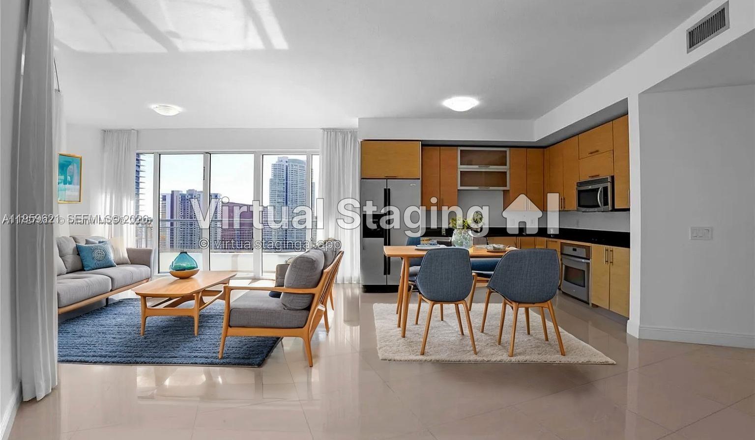 60 Southwest 13th Street, Unit 1700 Miami, FL 33130 - Photo 3 of 18 a living room with furniture and a large window