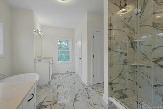 a bathroom with a sink and shower