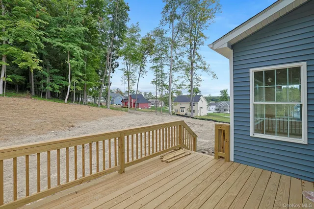 a view of balcony with wooden floor and fence