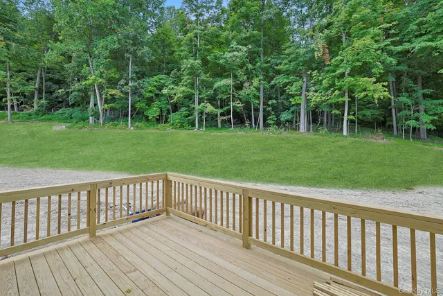 a view of deck with a trees