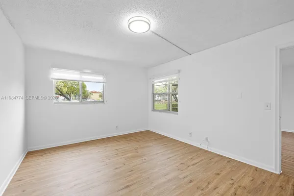 a spacious bathroom with a sink and a mirror