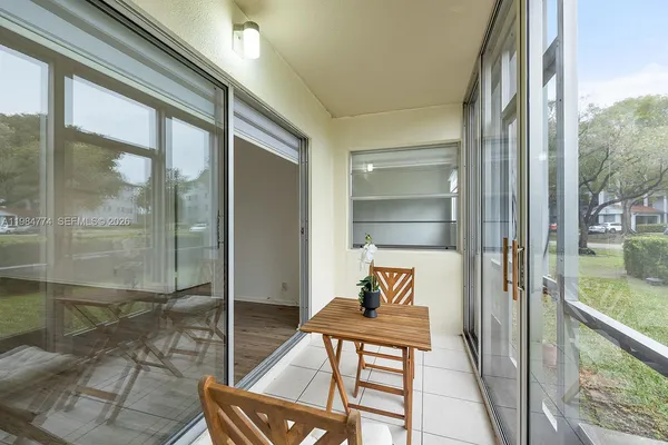 a view of a yard with palm trees