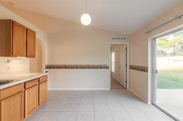 a view of a kitchen with a dishwasher and a refrigerator