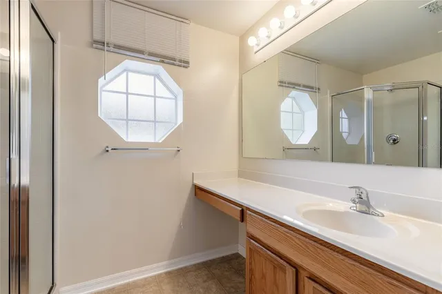 a bathroom with a sink a vanity and a mirror