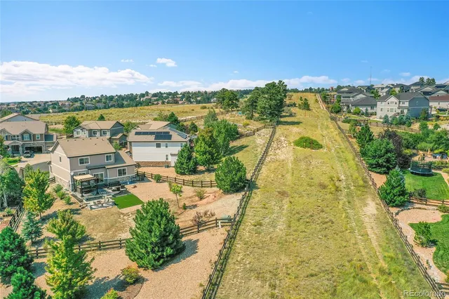 a swimming pool view with a outdoor seating