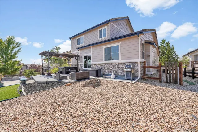 a view of a yard with an outdoor space and seating area
