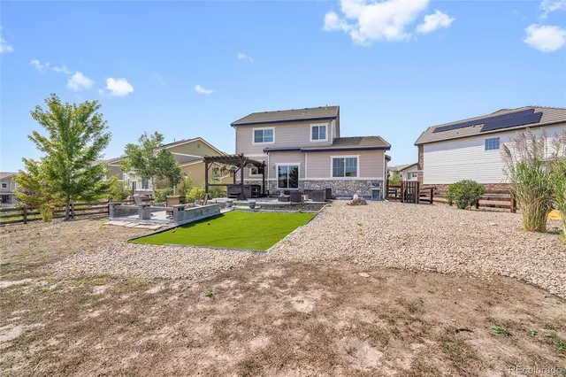 a kitchen with stainless steel appliances granite countertop a refrigerator a stove top oven a sink and dishwasher