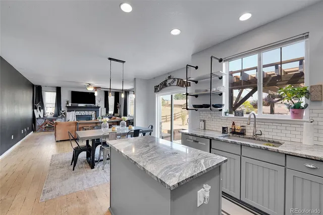 a kitchen with a sink and cabinets