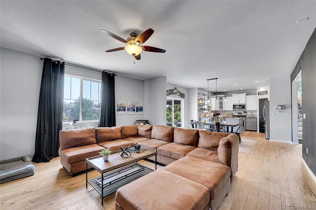 a dining room with furniture a window and a fireplace